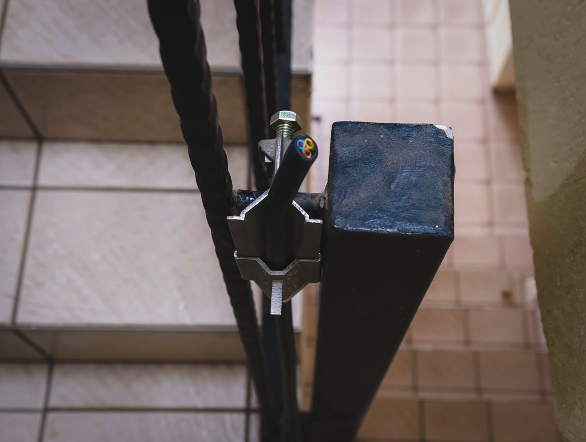 Stotko Stainless Steel Cable Clamp in vertical shaft installation